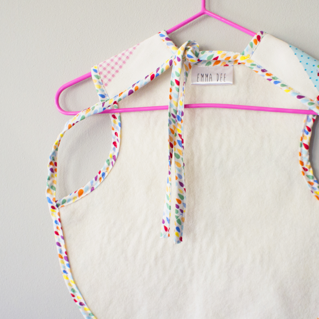 Baby bib apron with cat print cotton linen front with absorbent felt back suitable for children aged 6 months to 4 years old.