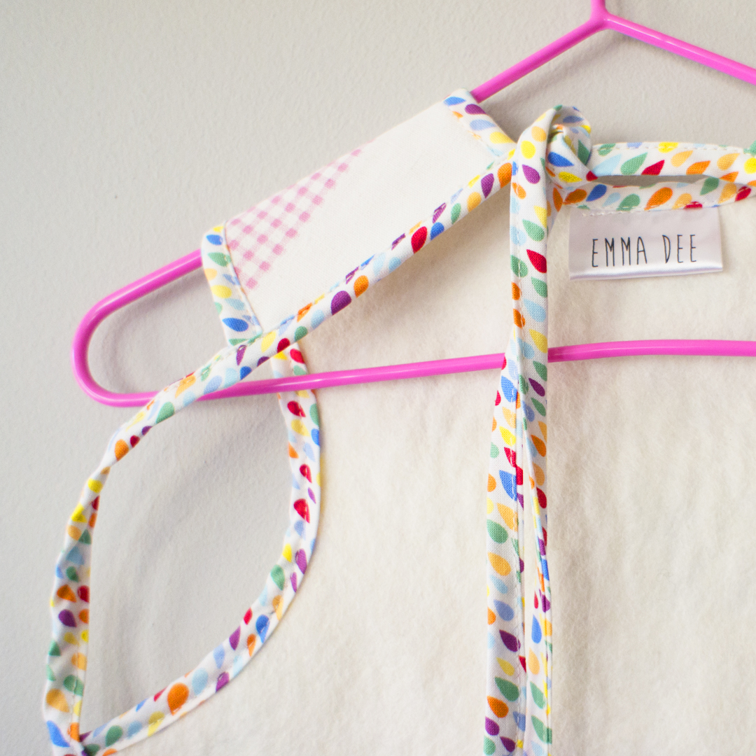 Baby bib apron with cat print cotton linen front with absorbent felt back suitable for children aged 6 months to 4 years old.